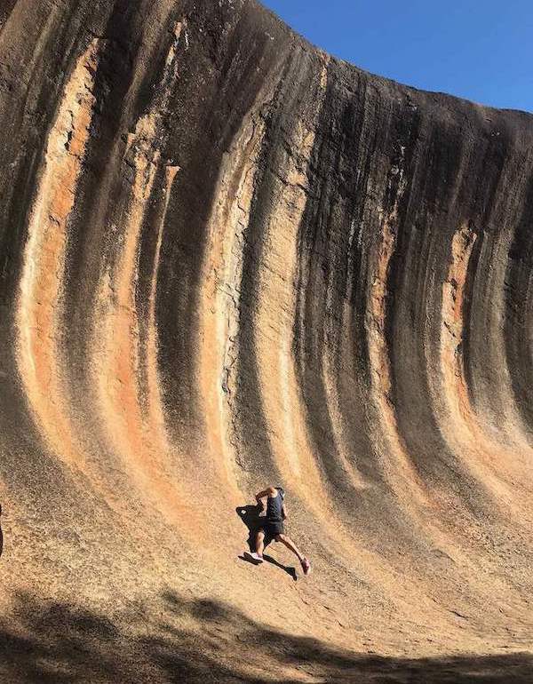 Trying to climb Wave Rock